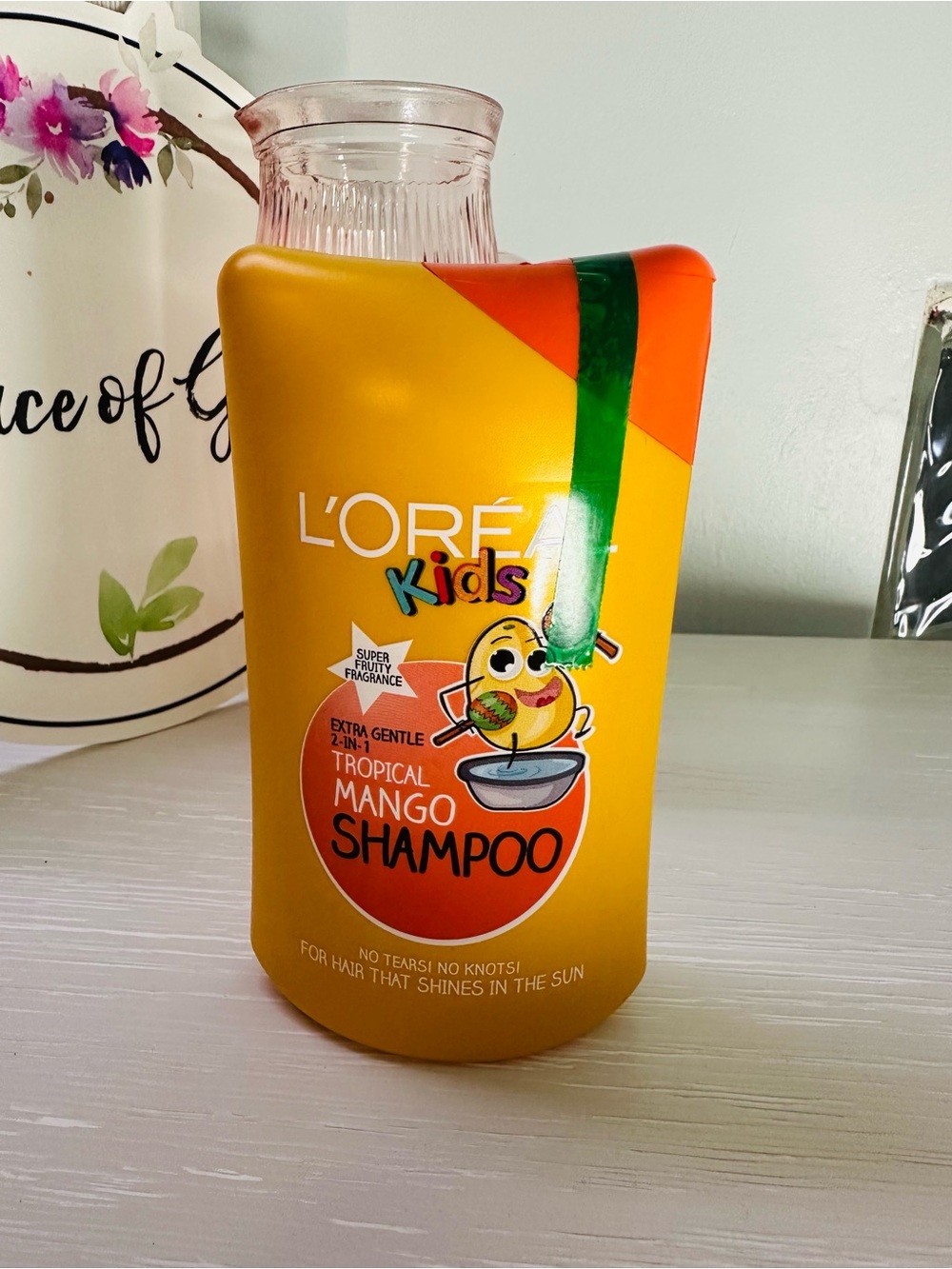 L'Oreal Kids Tropical Mango Shampoo - Yellow with Orange and Green Accents